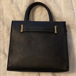 Mini black purse. Can be worn short or long.